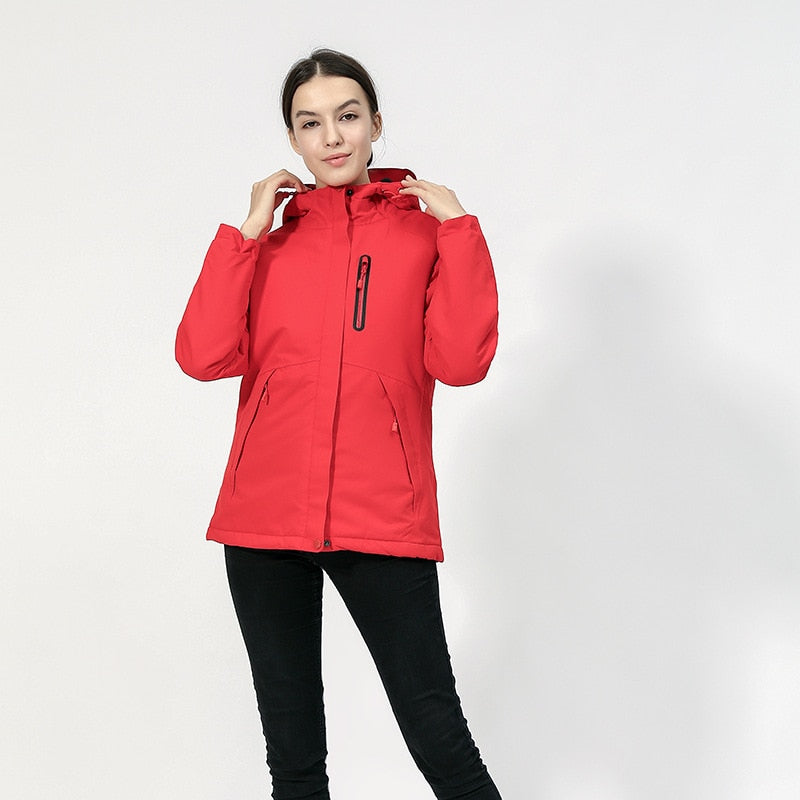 DEFROST - Heated Jacket in red worn by a woman
